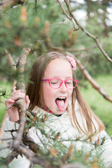 Little girl with glasses outdoor