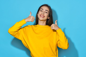 young woman with thumbs up