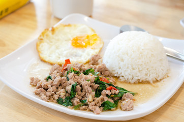Rice topped with stir-fried pork and basil.
