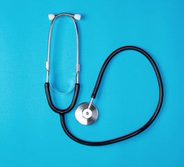 medical stethoscope on blue background