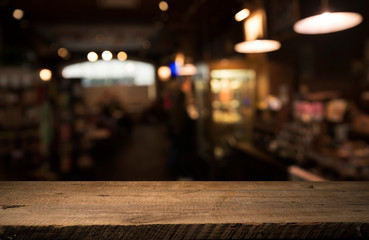 Beer barrel with beer glasses on a wooden table. The dark brown background.