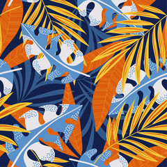 Original abstract seamless pattern with colorful tropical leaves and plants on blue background. Vector design. Jungle print. Flowers background. Printing and textiles. Exotic tropics. Fresh design.