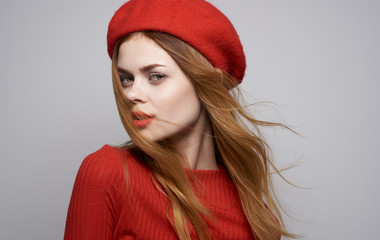 portrait of young woman in red hat