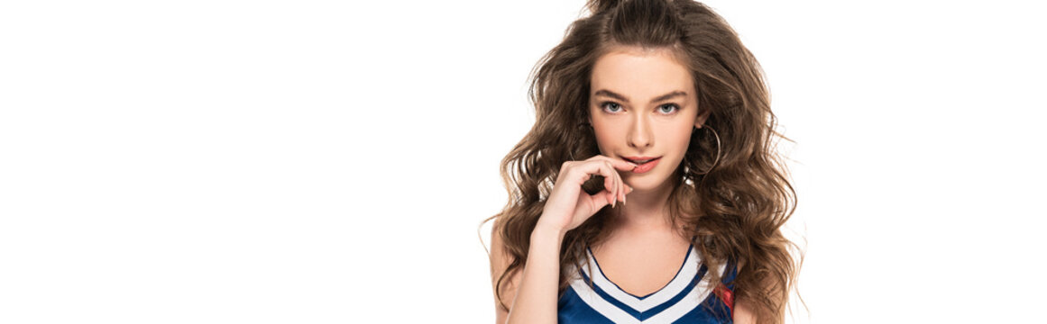 sexy seductive cheerleader girl in blue uniform touching lips isolated on white, panoramic shot