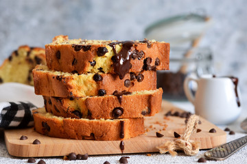 Vanilla bread with chocolate drops on the kitchen table. Slices of cake.