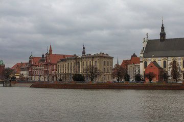 Fototapeta na wymiar Beautiful historic building on the banks of the Oder River in Wroclaw. Poland