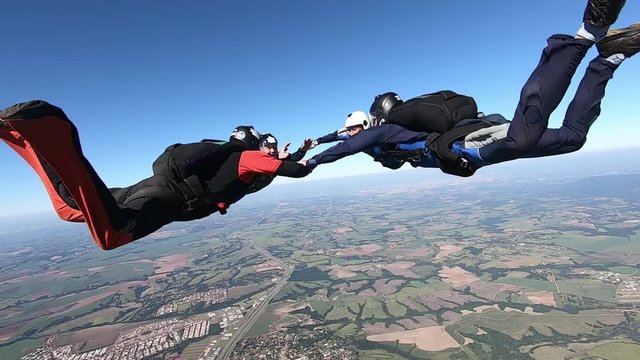 Skydive team formation clear sky slow motion