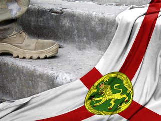 Military concept on the background of the flag of Alderney
