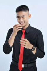 Portrait of young successful businessman looking happy. Happy casual business man laughing