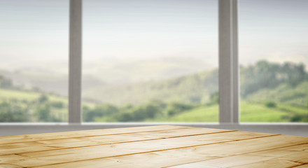 Table top and white window background and beautiful garden forest view in distance. Empty space on the table top for an advertising product.