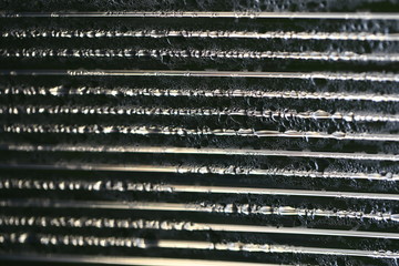 Water droplets on cellular polycarbonate, pattern and structure with variable scale and direction.