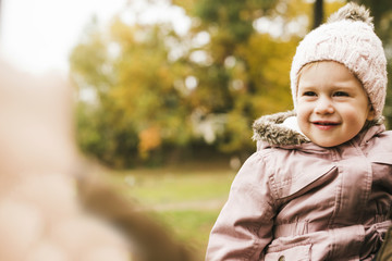 Smiling child in autumn park
