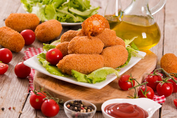 Supplì, italian fried rice balls.