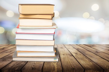 Colorful books collection on background.