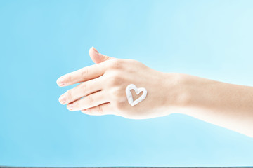 hand on blue background
