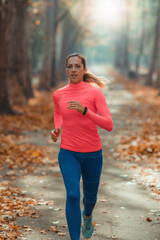 Woman Jogging Outdoors in Park