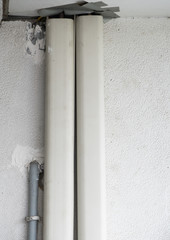 Plastic piping cover of the air conditioner system.
