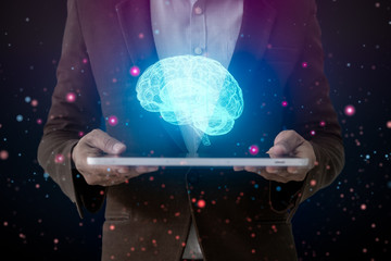 Obraz premium Human hand holding tablet and brain, AI (Artificial Intelligence)Technology, thinking or iot (internet of thing) concept.