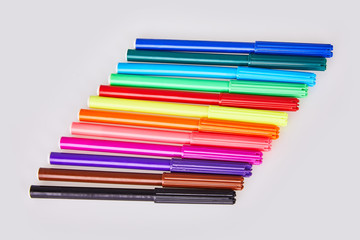 Close-up view of set of colorful felt tip pens isolated on white background. Multicolored soft-tip markers
