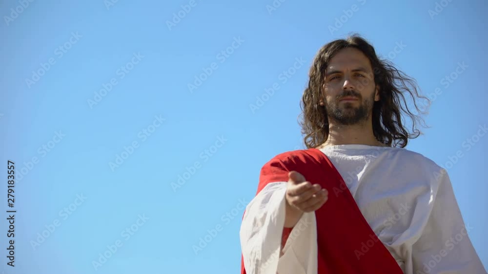 Wall mural Jesus reaching out hand against blue sky, forgiveness and salvation of sinners - Wall murals