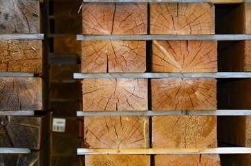 worked wooden boards stacked in a sawmill near Brunico. south tyrol, italy.