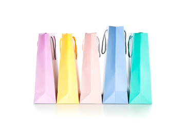 Multicolor paper bags isolated on white background