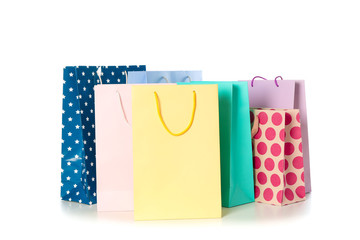 Multicolor paper bags isolated on white background