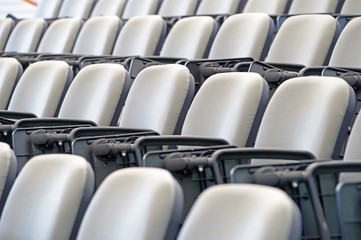 Fototapeta premium Empty stands with seats in the stadium