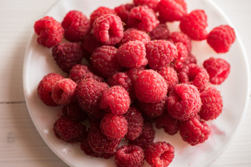 close of fresh organic summer ripe raspberries fileld frame 