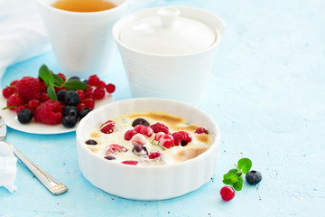Zabaglione with champagne and berries. French dessert.