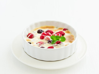 Zabaglione with champagne and berries. French dessert.