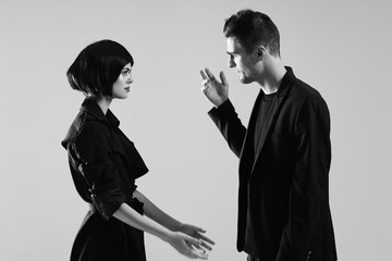 man and woman with bottle of red wine