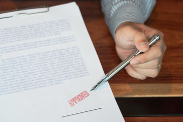 male point to signing business document for putting signature, fountain pen and approved stamped on a document, certificate contract agreement lawyer hand concept.