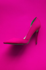 Photo of trendy fancy modern fashionable women luxury pink high heel shoe on a pink background in studio