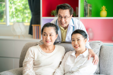 Happy medical doctor consultant with middle age women