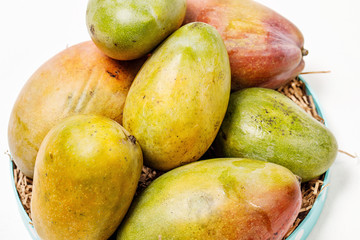 ripe fresh colorful mango on a paper Mat