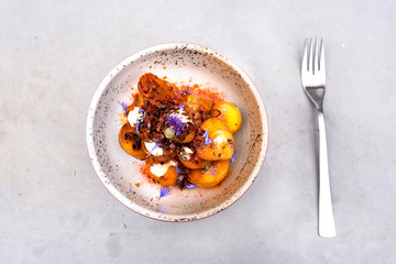  native potatoes with cheese and edible flowers