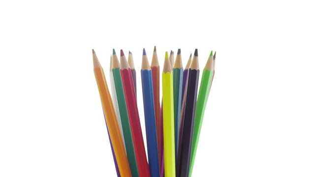 Close-up Colored Pencils Assembled Together Revolve in a White Background
