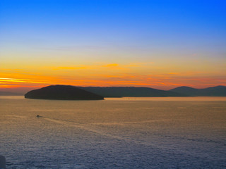 Beautiful morning panorama of Adriatic sea near Split, Croatia. A panoramic view at dawn of a water, sky with a dawning, silhouette of coastline of islands. Nautical landscape of bay in West Europe.