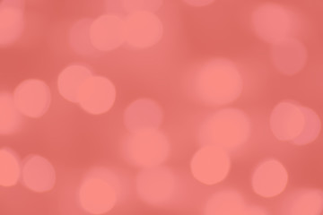 Living Coral trendy color of the Year 2019. Blurred bokeh background. Abstract light bokeh background