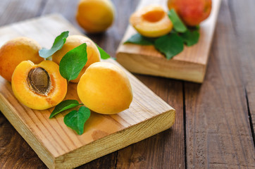 Ripe apricots beautifully lying on natural boards.