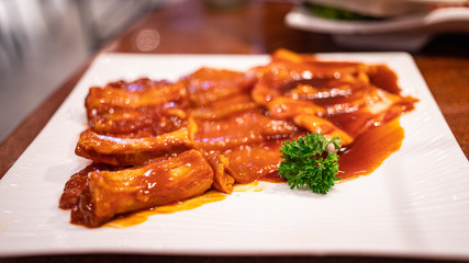 Plate of raw pork ribs for grilling