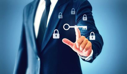 Businessman touch a virtual key that represents the discovery of victory or success in business.