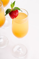 Glasses of wine and champagne with strawberry iIsolated on white background, close up. Party and holiday celebration. The buffet at the reception.
