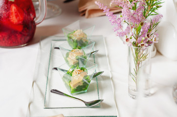 Top view catering banquet table with cold snacks. Chuka Seaweed Salad in bowl, close up. Dishes in the restaurant. Easy food for guests. Party food.
