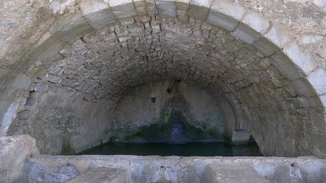 Ancient rock built water cistern seen in Northern Crete