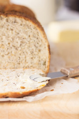 Fototapeta na wymiar Slice of bread, butter knife and butter