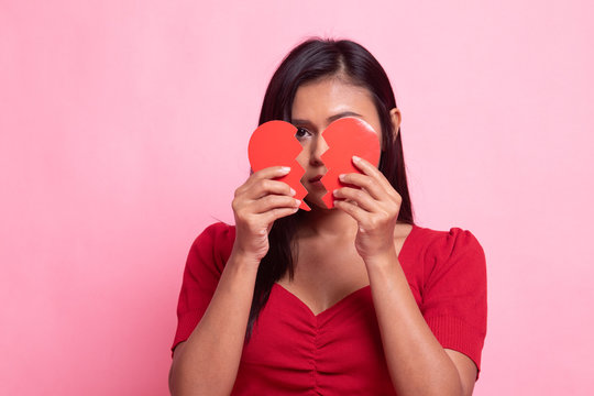 Beautiful young Asian woman with broken heart.