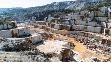 Marble quarry pit full of rocks and blocks in Marmara island, Turkey