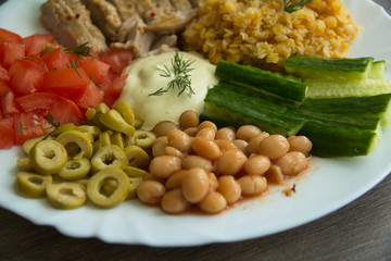 Lentils, chicken, olives,white beans, cucumbers, tomatoes and sauce